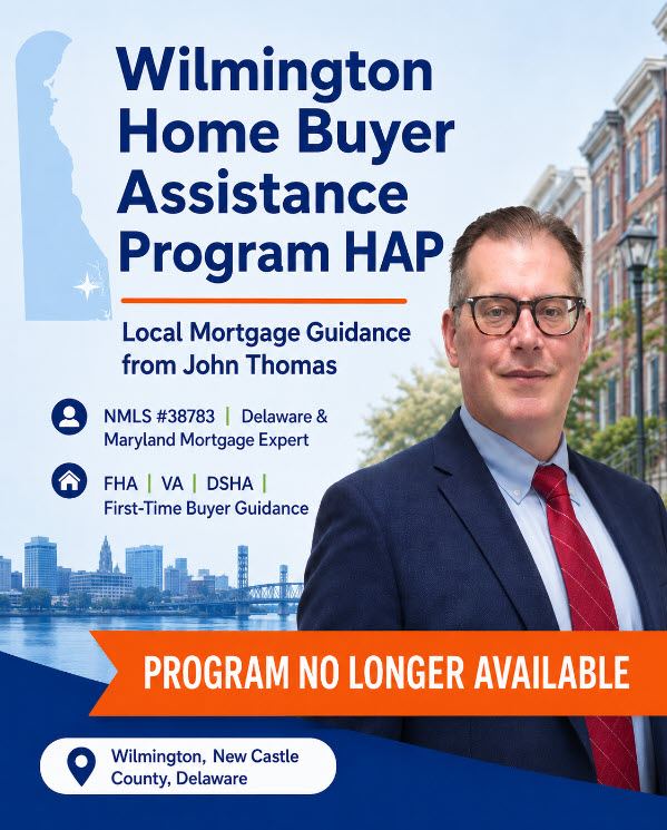 Mobile view of John Thomas, mortgage loan officer with the John Thomas Team, in front of a Wilmington Delaware row-house street holding current DPA program alternatives - NMLS #38783